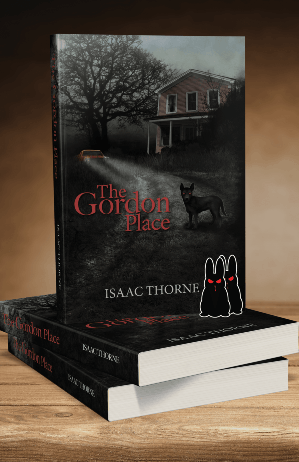 Three paperback copies of THE GORDON PLACE. Two are stacked on top of each other. A third sits atop the stack so that the front cover is visible. Two evil bunny stickers are propped against the vertical book.